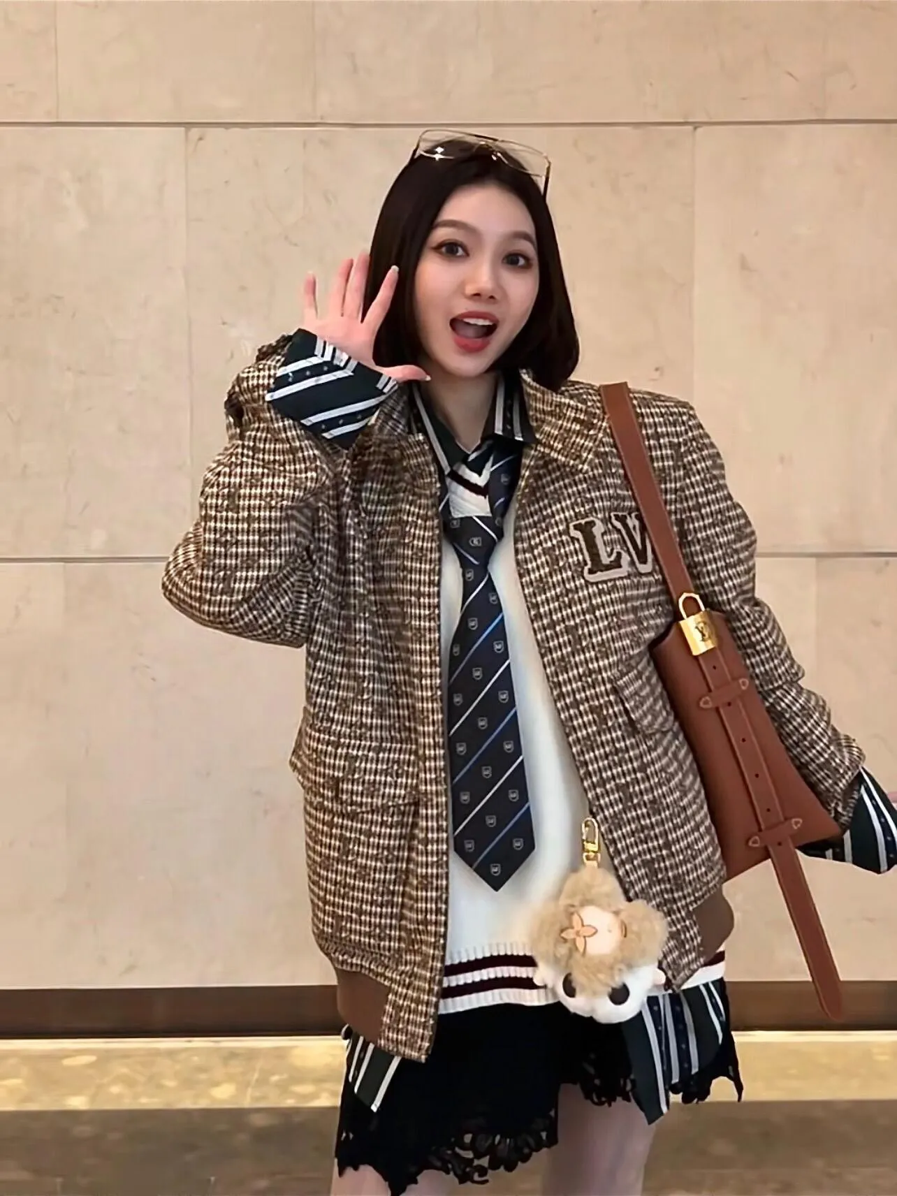Louis Vuitton jacket with embroidered badges and all-over monogram print.